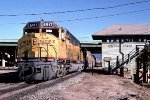 UP 6917 west crosses the SP at Colton tower,